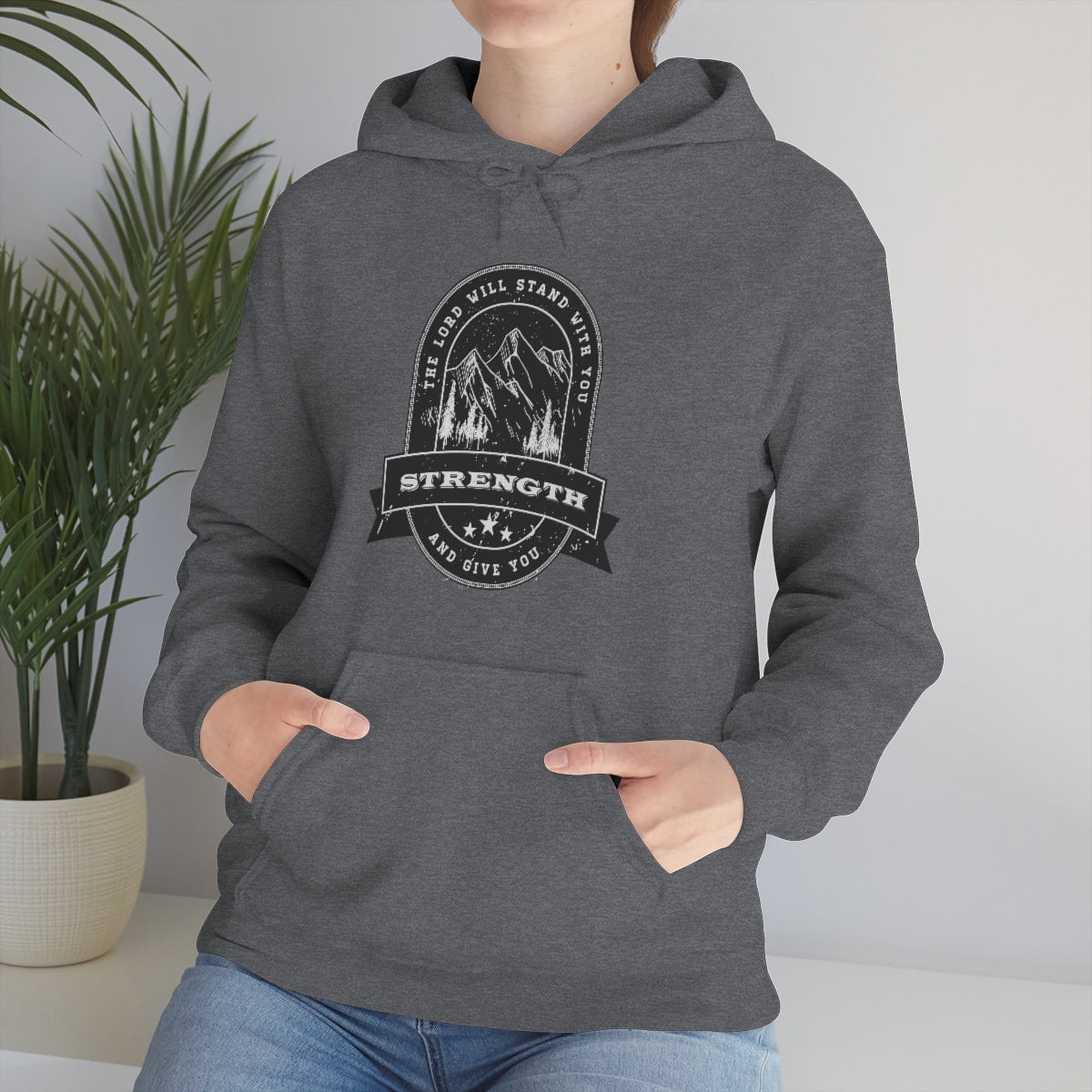 When you wear this hooded sweatshirt, you are instantly empowered with the truth that God will stand with you and give you strength. No matter what life throws your way, you can be hopeful knowing that the LORD is right by your side. This shirt is the perfect way to share your faith with those around you and let them know that they are not alone in their struggles. With its simple and encouraging message, you can help lead someone to Christ.