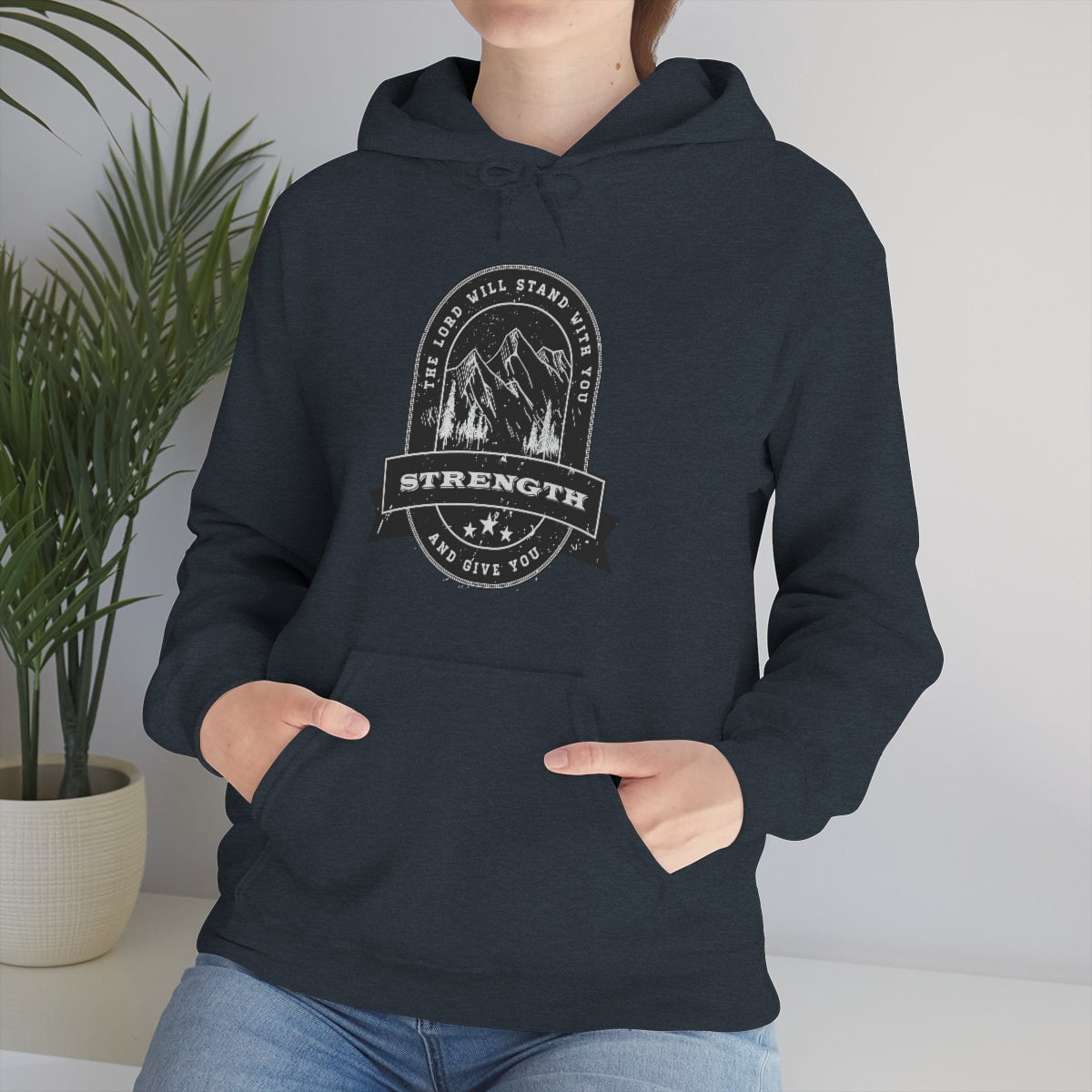 When you wear this hooded sweatshirt, you are instantly empowered with the truth that God will stand with you and give you strength. No matter what life throws your way, you can be hopeful knowing that the LORD is right by your side. This shirt is the perfect way to share your faith with those around you and let them know that they are not alone in their struggles. With its simple and encouraging message, you can help lead someone to Christ.